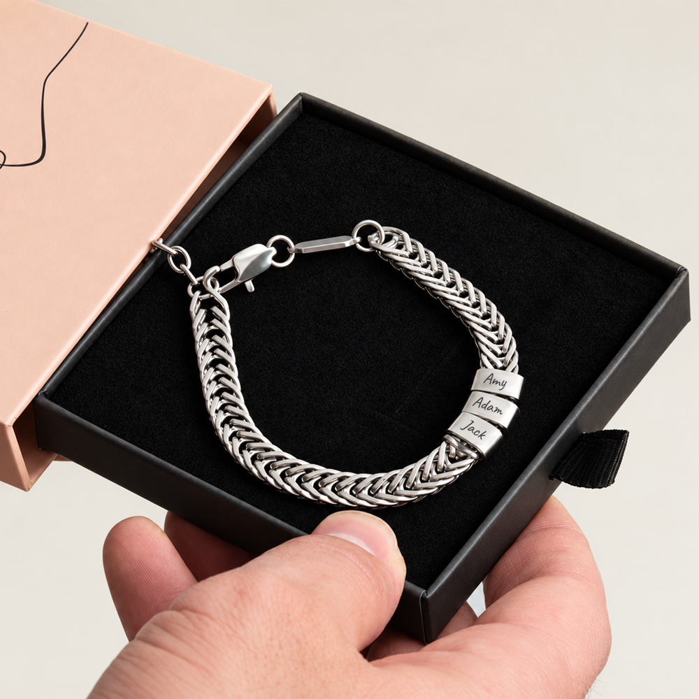 Personalized dad bracelet with engraved name charms on a man's wrist