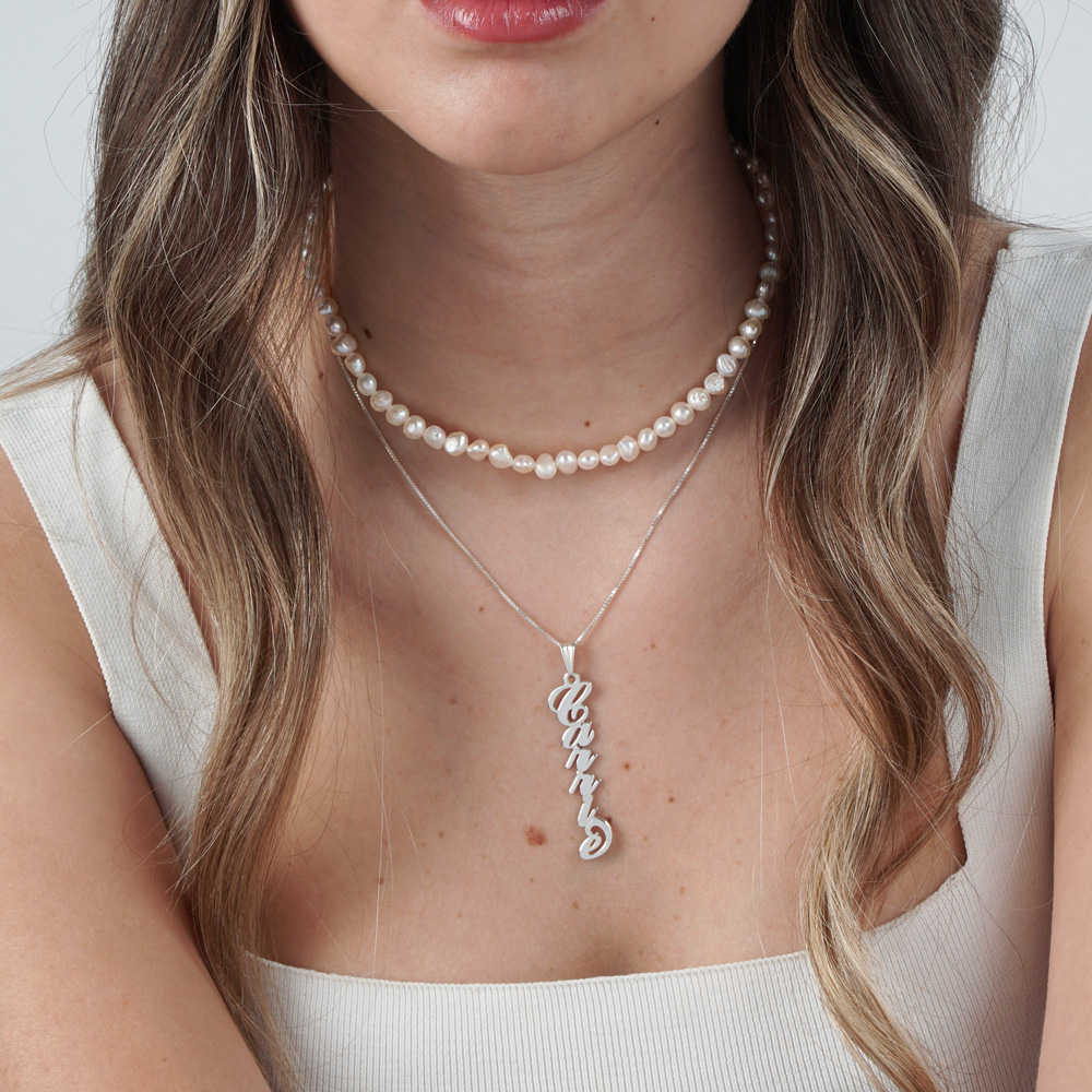 Vertical Carrie Name Necklace on a model
