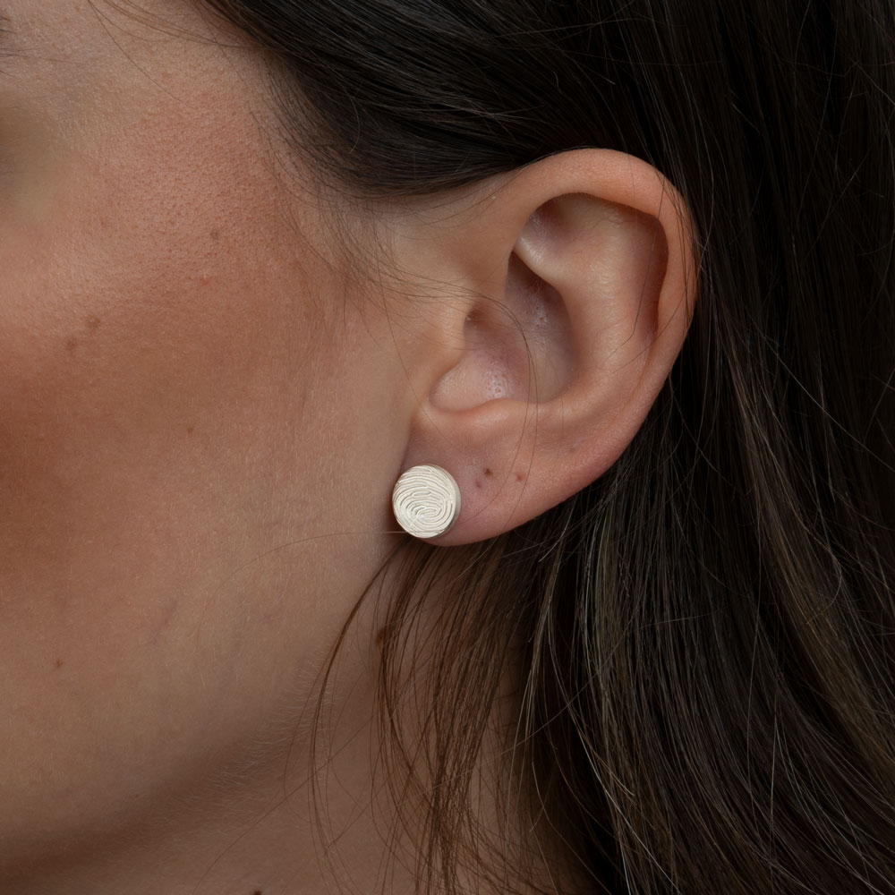 Fingerprint Earrings on a model