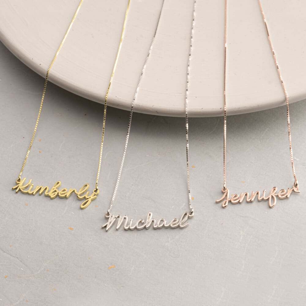 Light Cursive Name Necklace on a model - 2