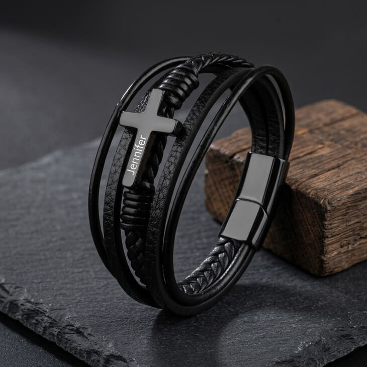 Stylish Leather Cross Bracelet for Men featuring a silver engraved cross detail.
