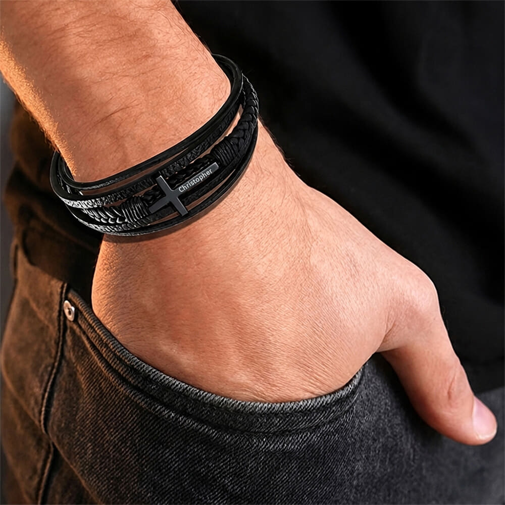 Model showcases Leather Cross Bracelet for Men, styled with casual attire.