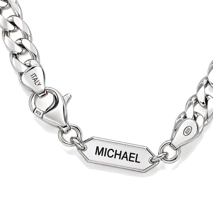 Detail shot of personalized Cuban chain necklace featuring MICHAEL engraved bar