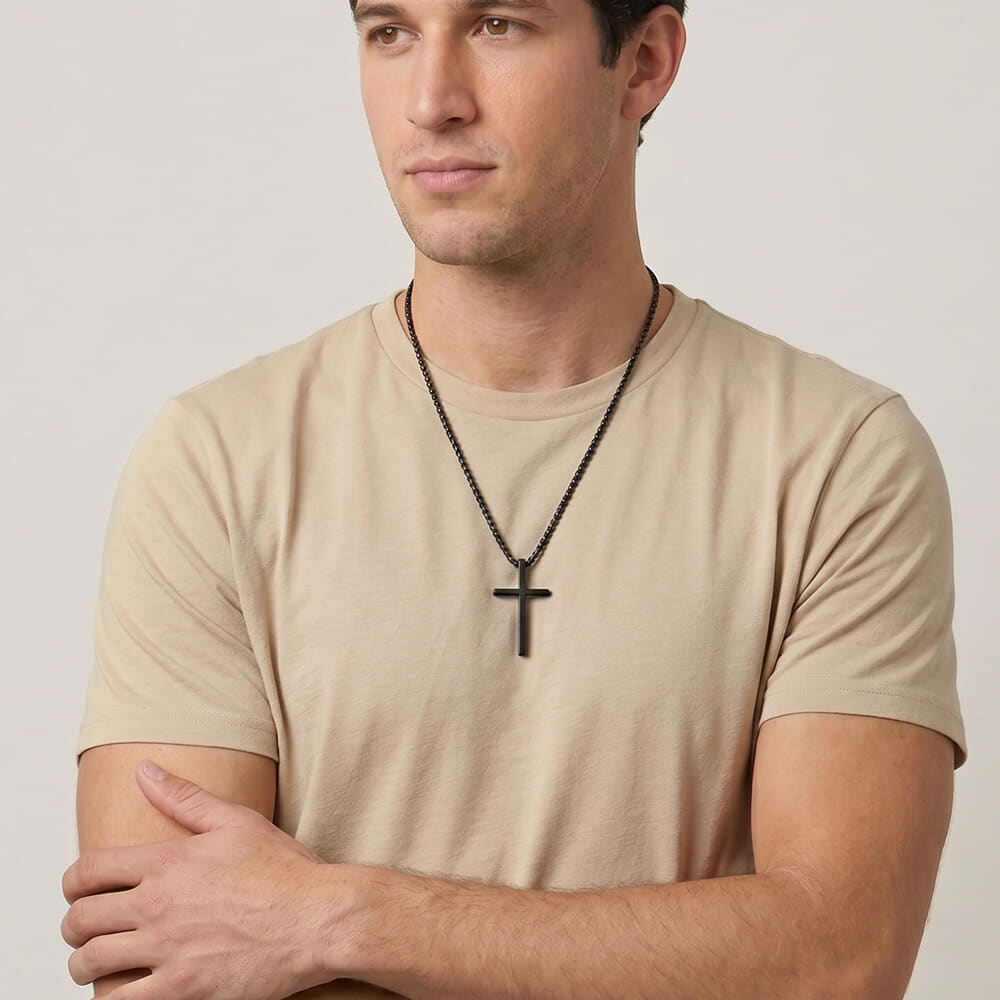 Model displaying Men's Black Cross Necklace with name engraving in a laid-back look