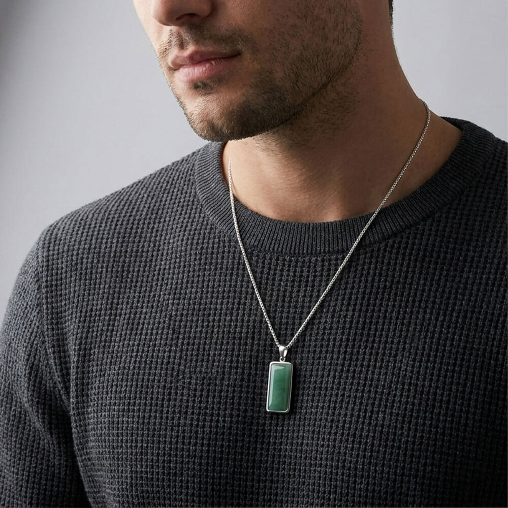 Model showcasing the Emerald Edge Pendant necklace with green aventurine stone