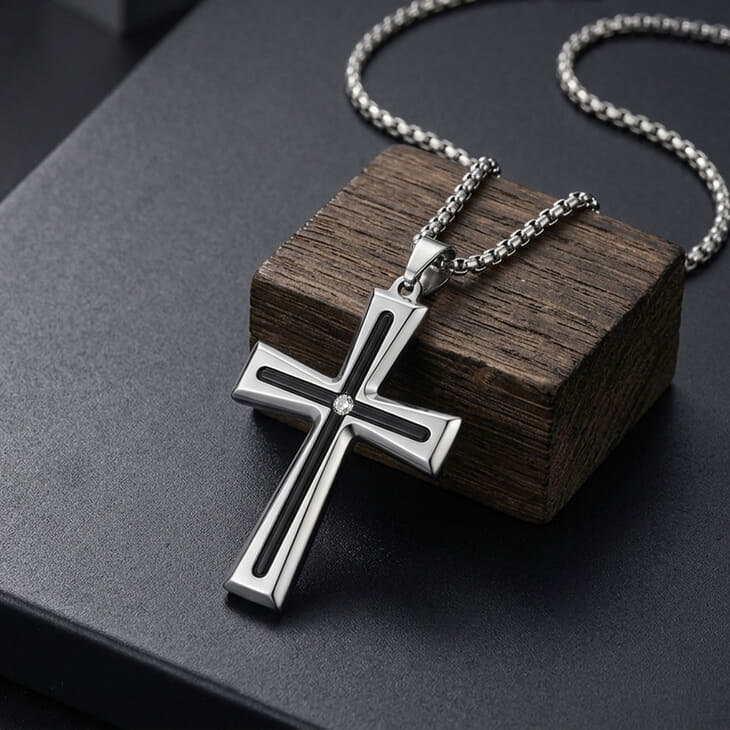 Men's Black Inlay Cross Necklace in silver on a dark background with textured wood