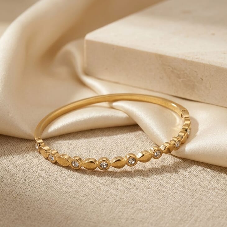 Alternating CZ Bangle Bracelet in gold, showcasing a delicate marquise design