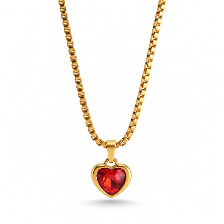 Gold heart-shaped pendant necklace with a dazzling red gem