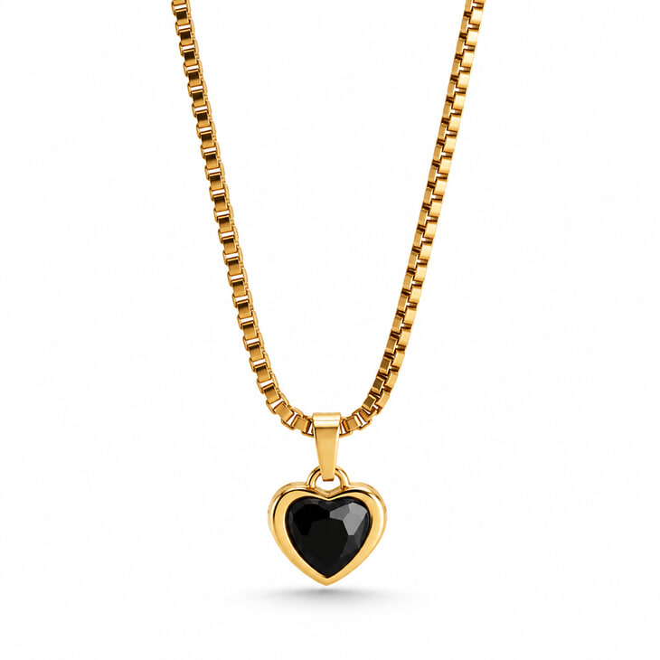 Gold heart-shaped pendant necklace with an eye-catching black gem