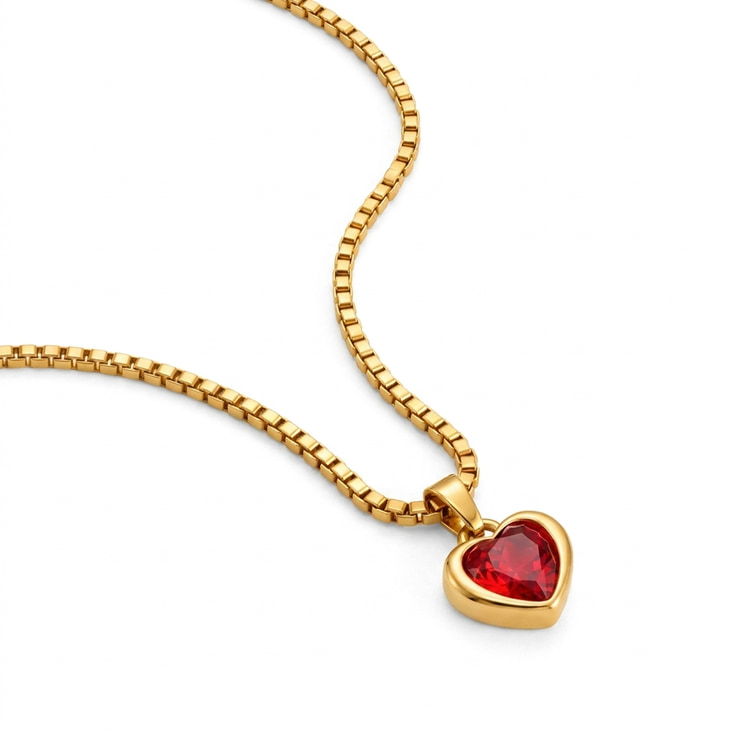 Gold heart-shaped pendant necklace with a radiant ruby gem